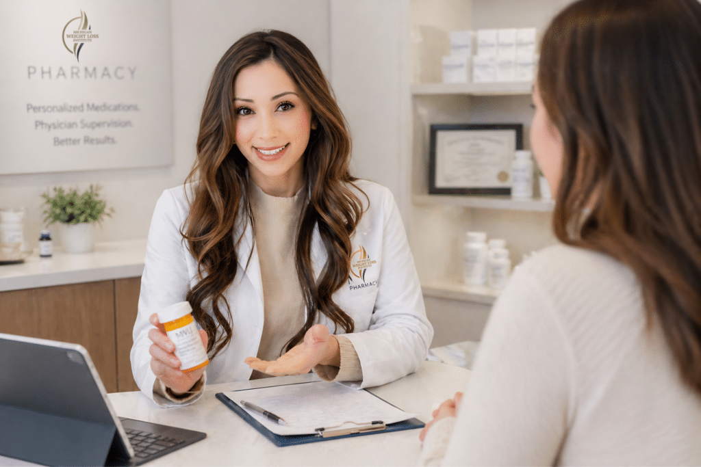 Licensed pharmacist at Michigan Weight Loss Institute reviewing personalized weight loss medications with a patient during a pharmacy consultation.